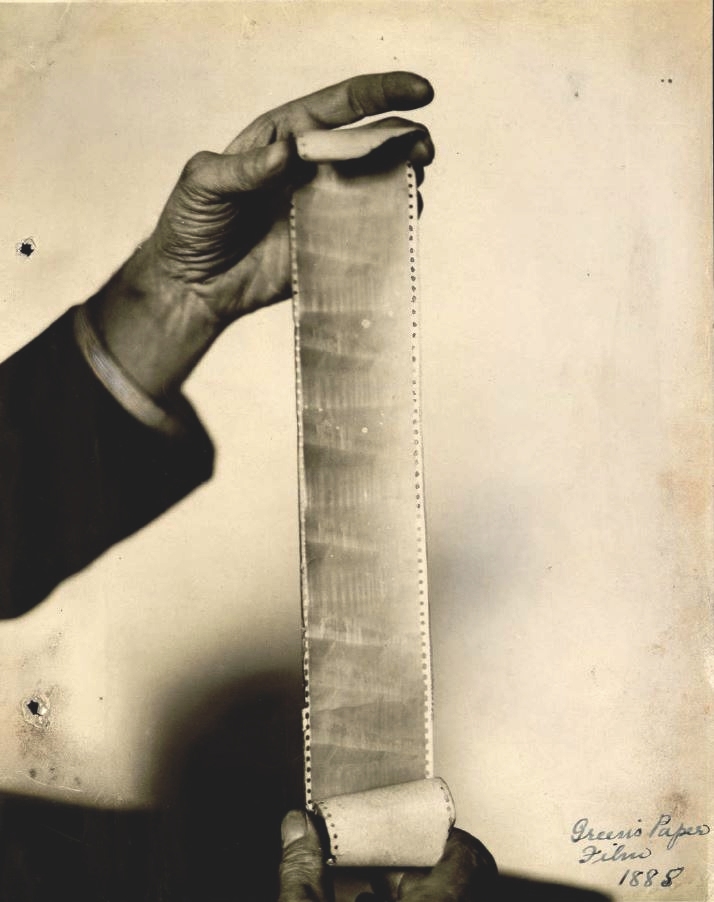 Will Day holds up paper film - from book edit